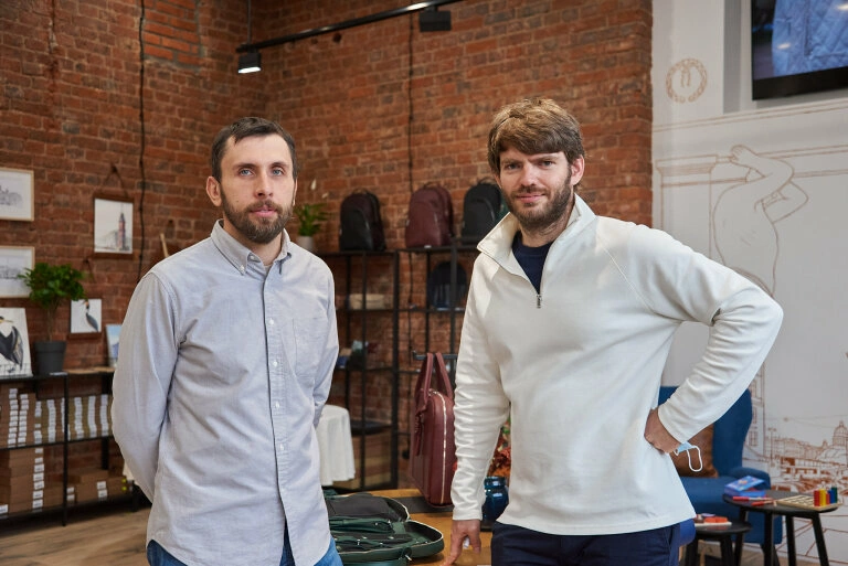image of a tailor with a costume in the background